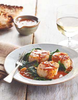 Cider Seared Scallops with Wilted Garlicky Spinach