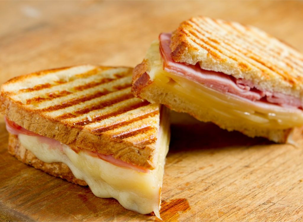 A ham and cheese panini sandwich