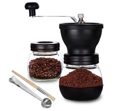 Paracity manual coffee grinder filled with coffee grounds while sitting next to a jar with coffee beans inside.